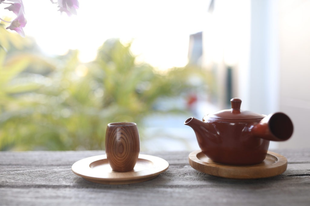 Wooden teapot and brown tea pot earthenware kettle