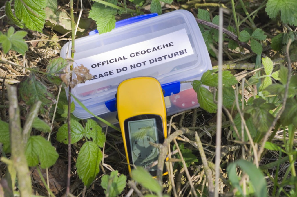  A geocache and GPS. Geocaches are hidden all over the world. You can download the coordinates to a GPS device and track them, record your details when found, and register on the website. This is a very popular pastime in many countries. A hide-and-seek game that is enjoyed by people of all age