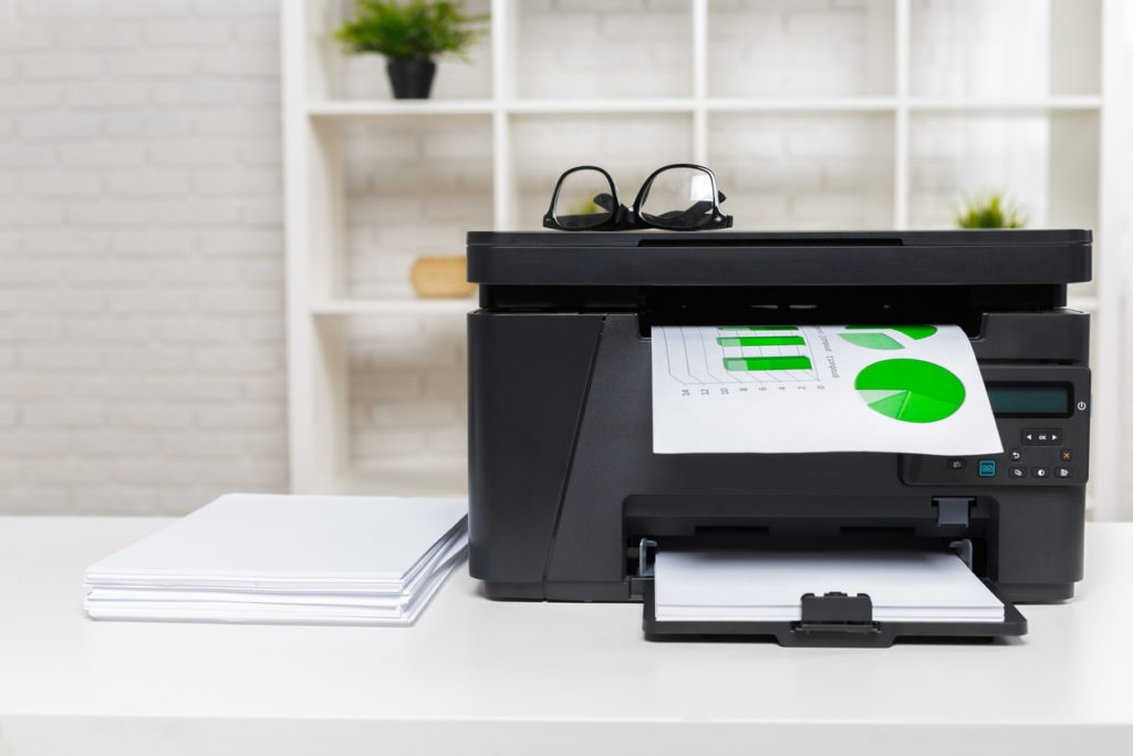 A printer printing green images.