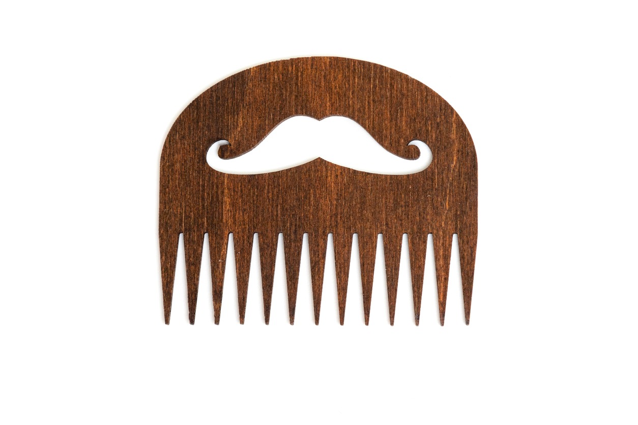 A wooden beard comb
