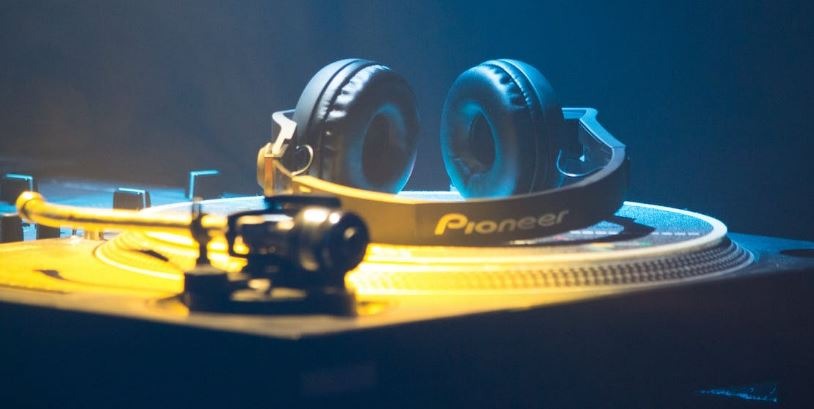 Headphones on disc of DJ console.