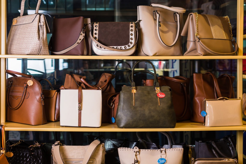 Image of a shelf full of different types of handbags