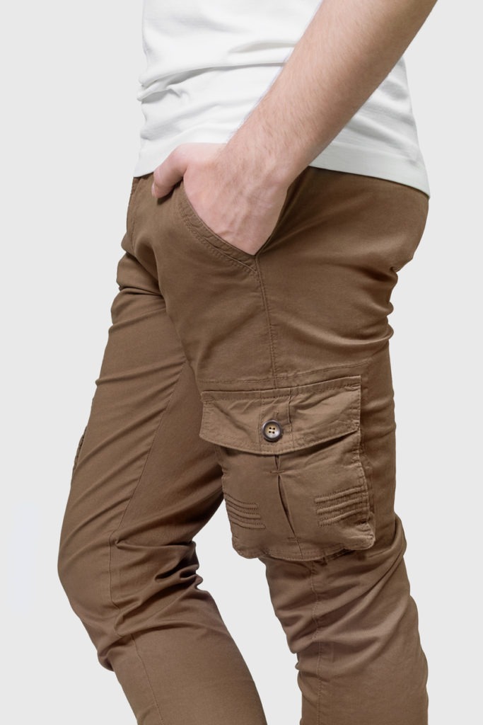 Man wearing cargo pants with hand in pocket.