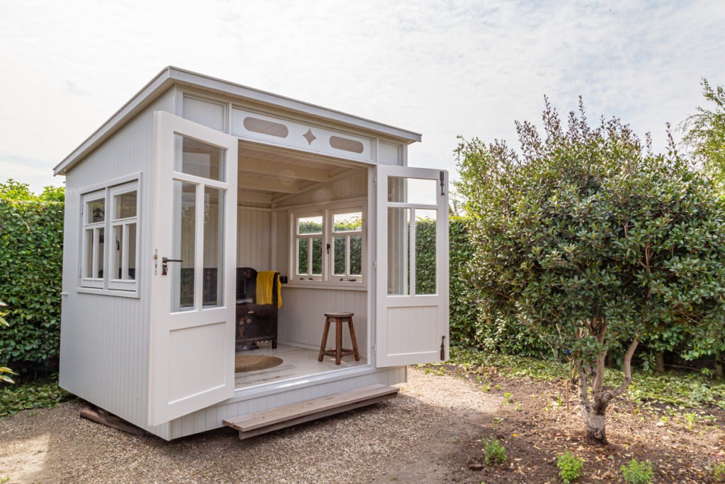 White garden shed designed to be a home office.