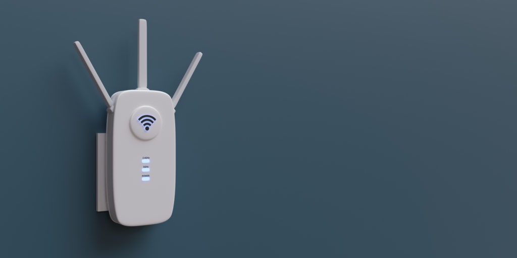 WiFi extender, wireless repeater isolated on blue wall.