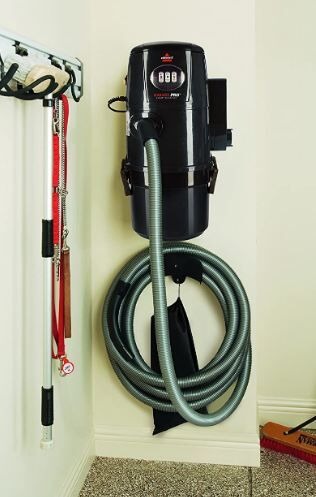 a-black-vacuum-cleaner-mounted-on-the-wall