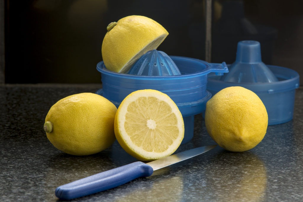 a lemon about to the manually juiced