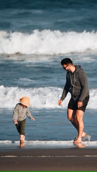 a picture of father and son at the beach