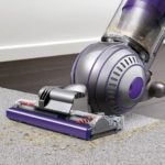 cleaning-a-carpet-using-a-Dyson-vacuum-cleaner