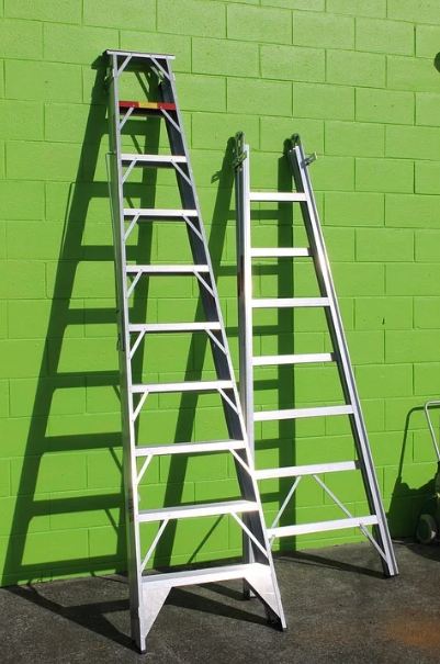 ladders-two-ladders-green-wall