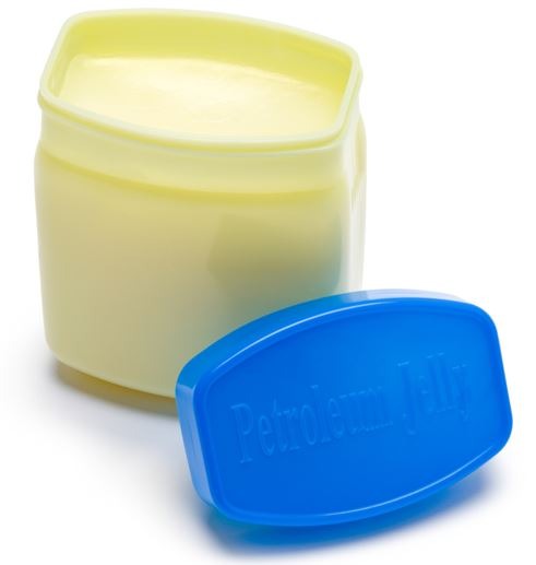 opened petroleum jelly jar with blue lid in white background