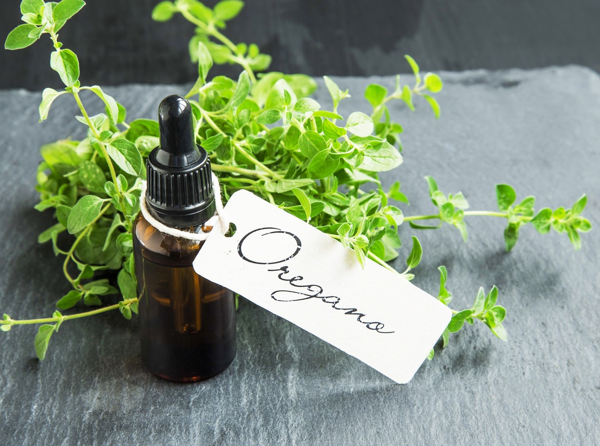 oregano oil bottle with label with oregano leaves