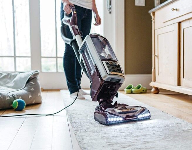 person-using-a-Shark-vacuum-cleaner