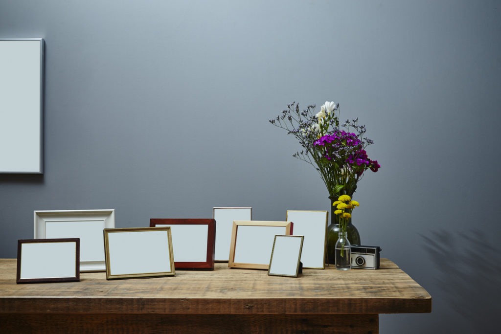 pictures frames on the top of a table