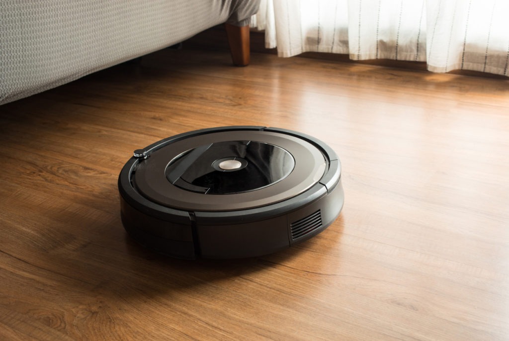 Robot vacuum cleaner on wood,laminate floor.Smart life concepts