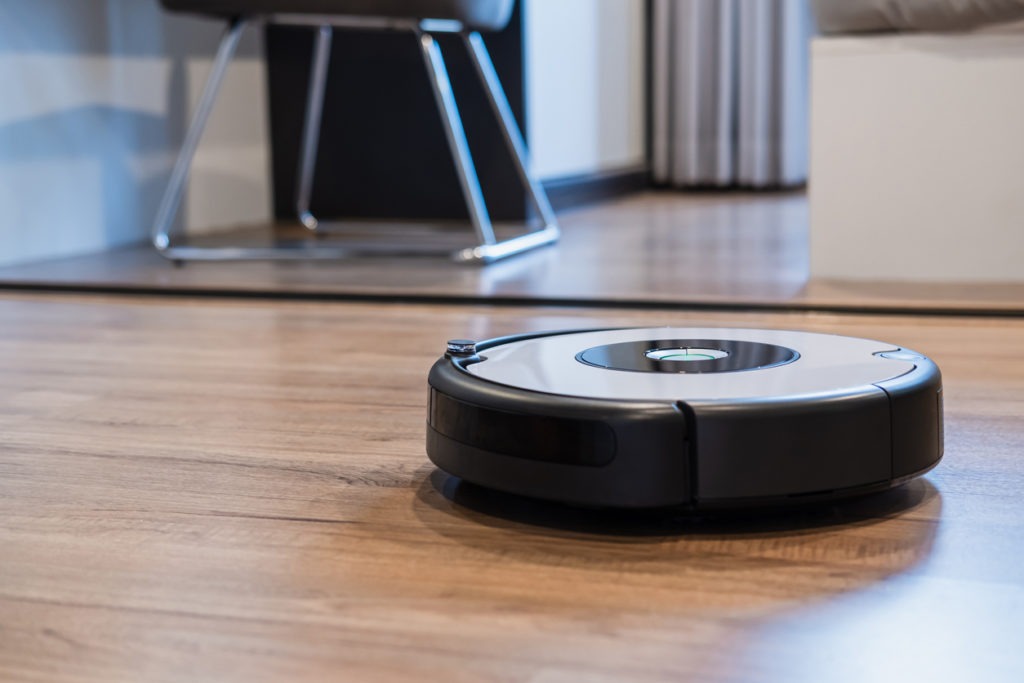 a robot vacuum cleaning the floor