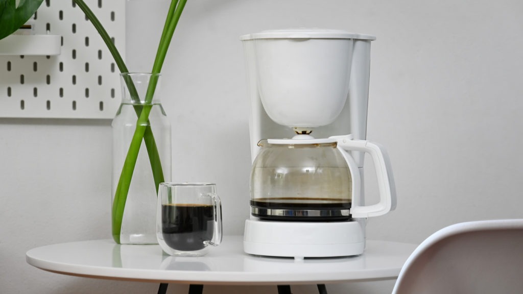 an electric drip coffee maker on a table