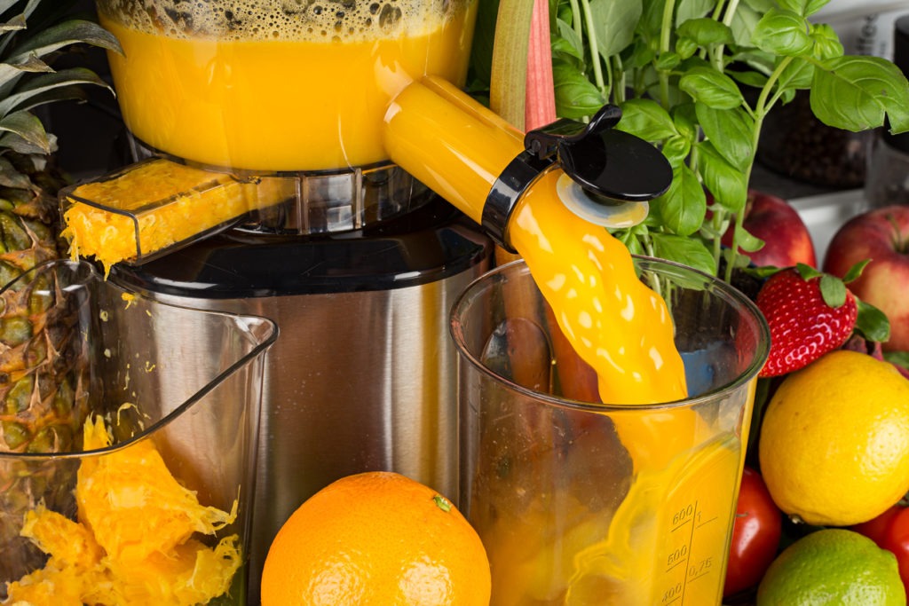 getting fruit juices from a masticating juicer