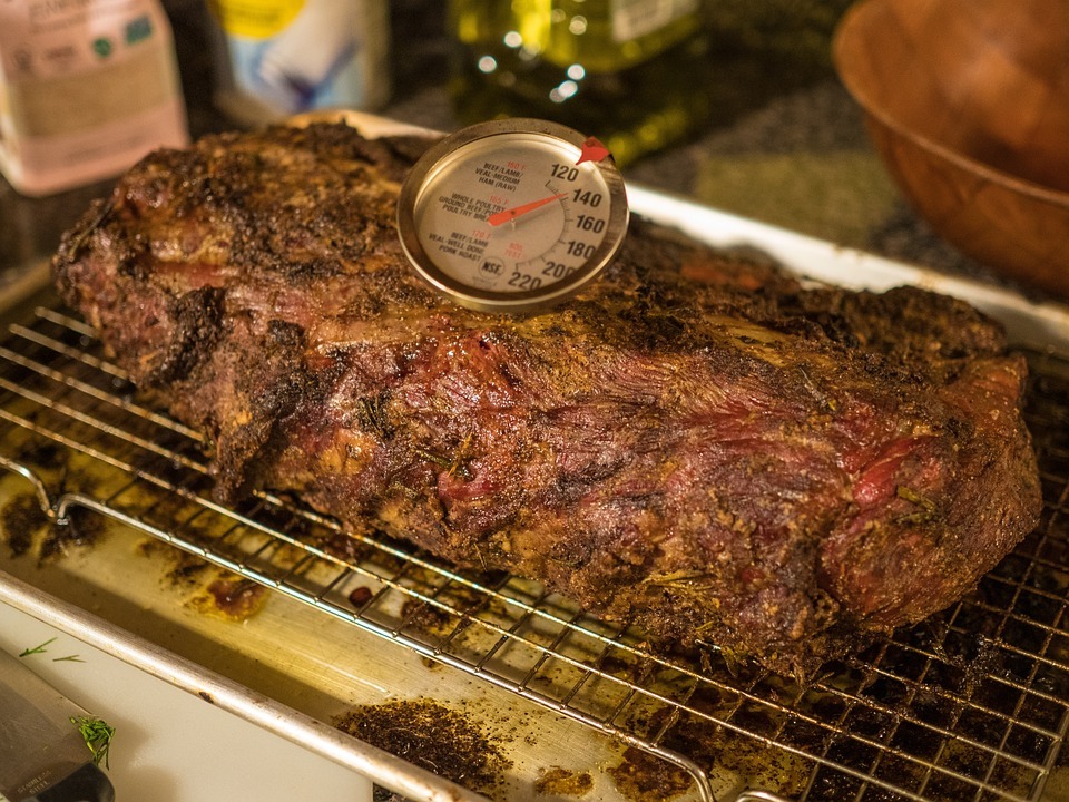 Roasted beef with thermometer on top