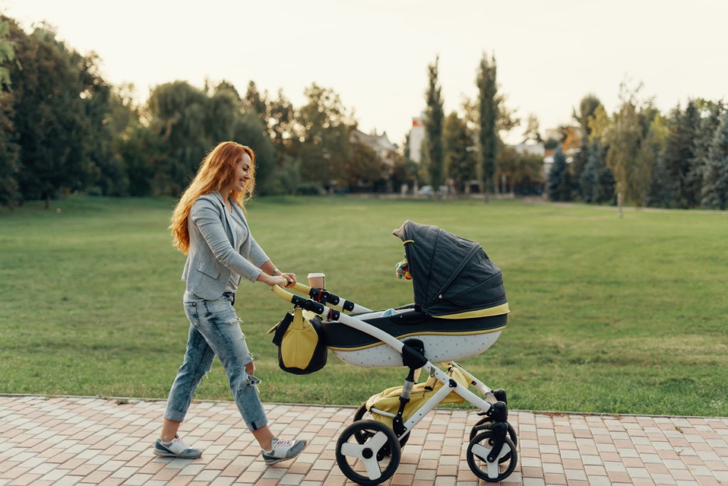 woman enjoying walking with a stroller