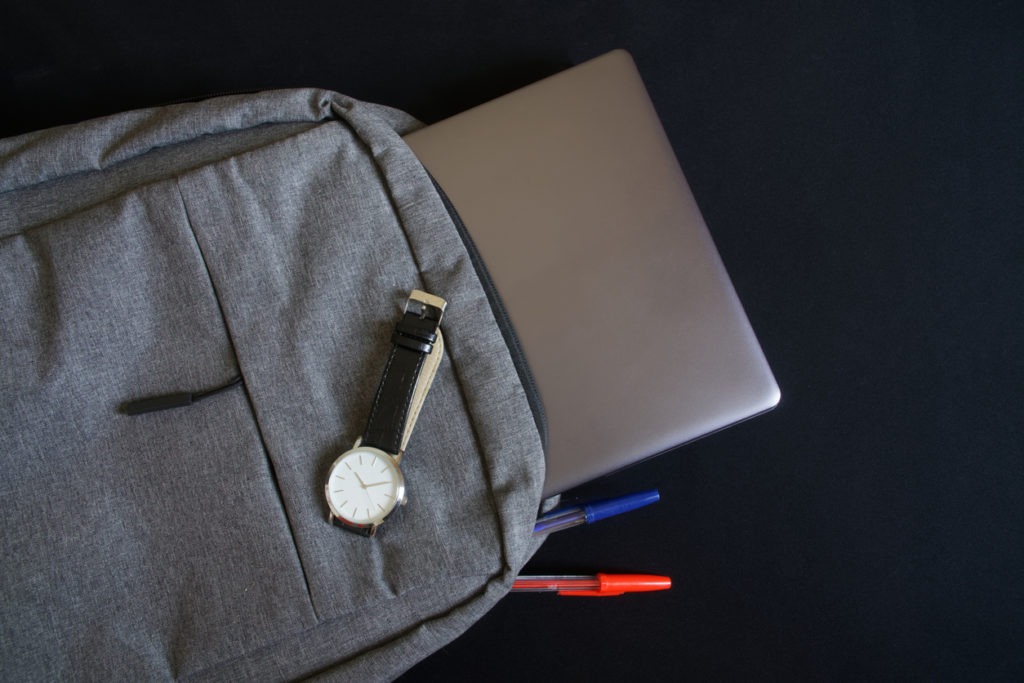 Backpack with laptop and pens for students