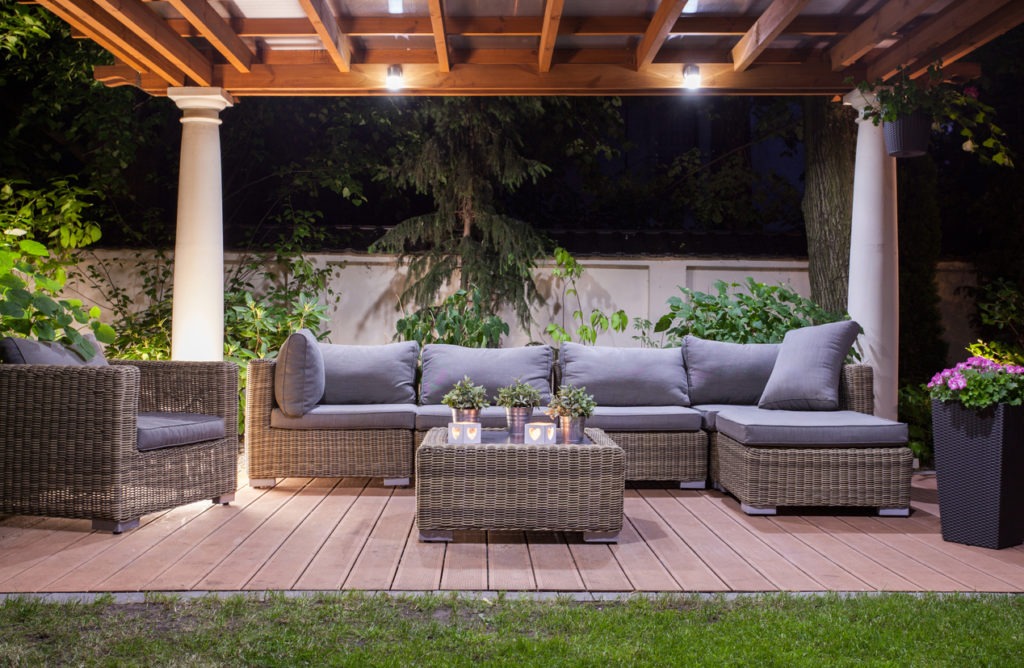 Modern patio with furniture at night