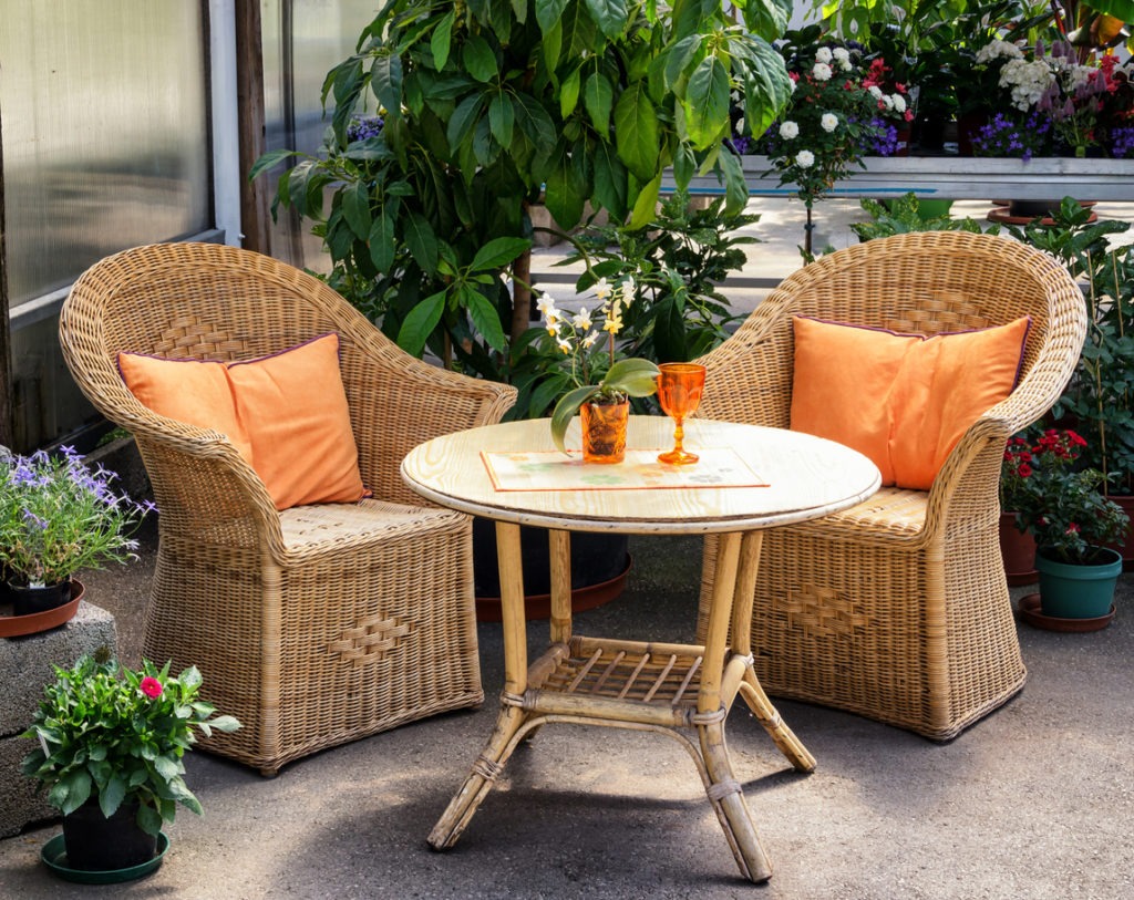 an outdoor bistro set made of rattan