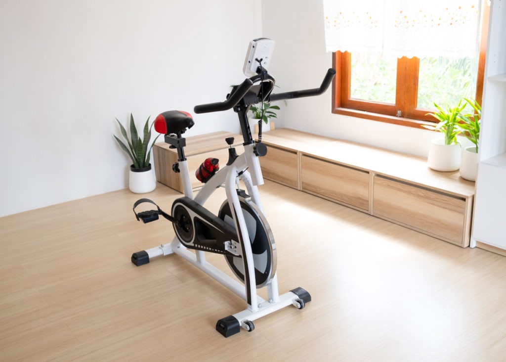 Exercise bike in the living room.Minimal room.