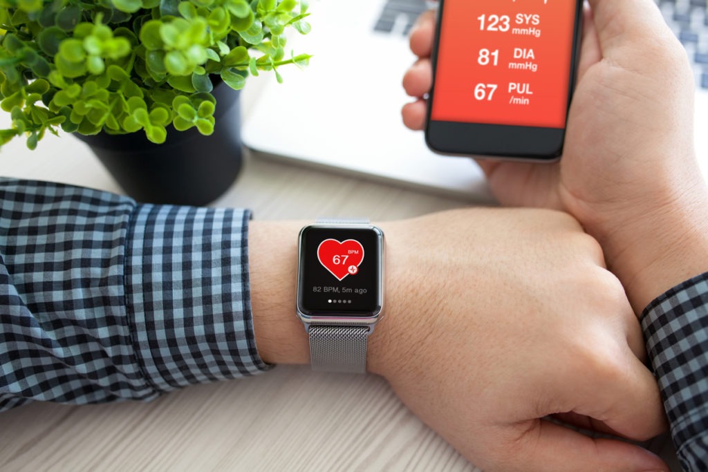 Man hands with watch and phone with app health
