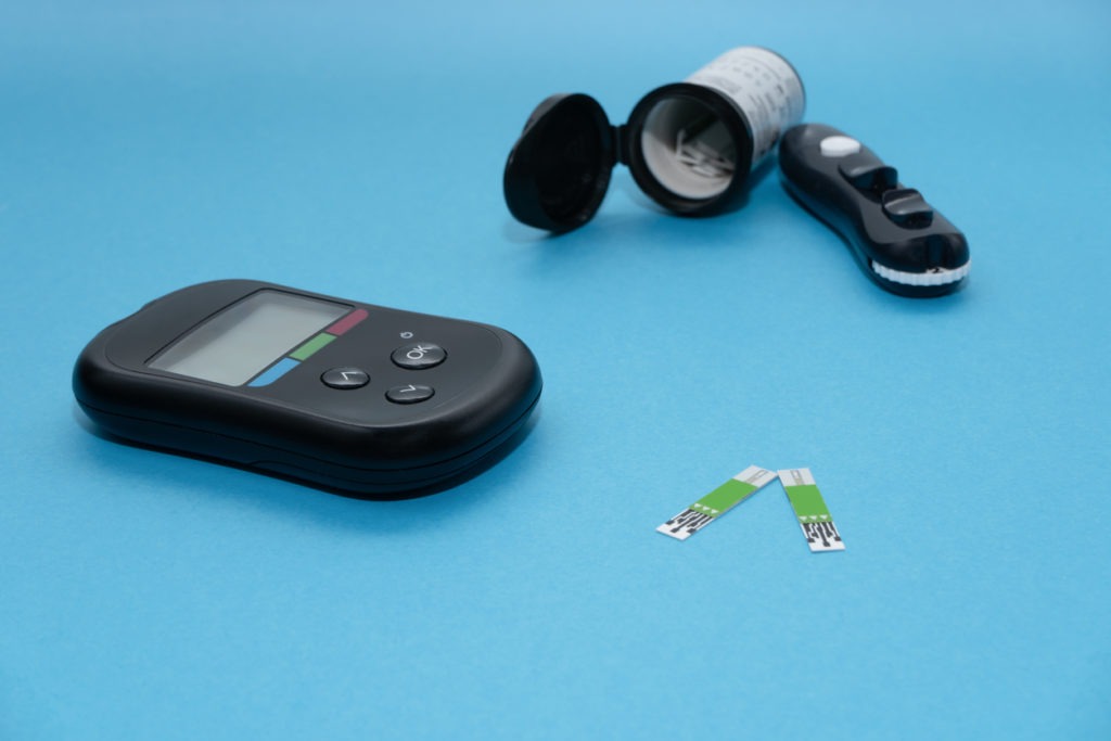 Modern glucose meter with test strip and lancet pen