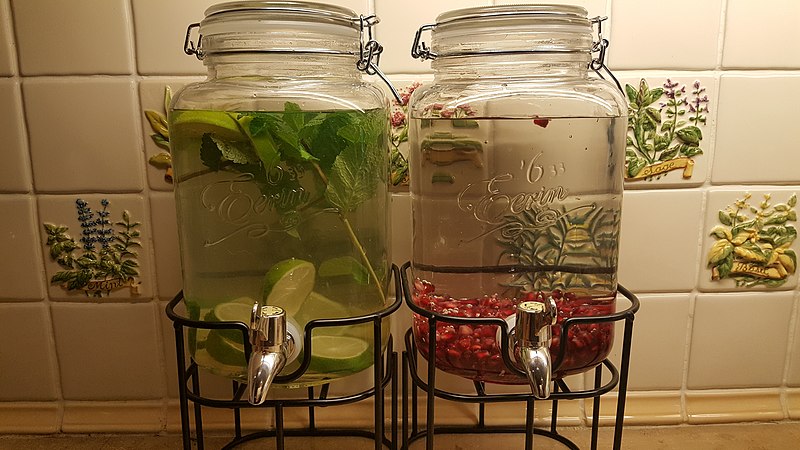 Left side: Lime, ginger, and mint infused water. Right side: Pomegranate infused water