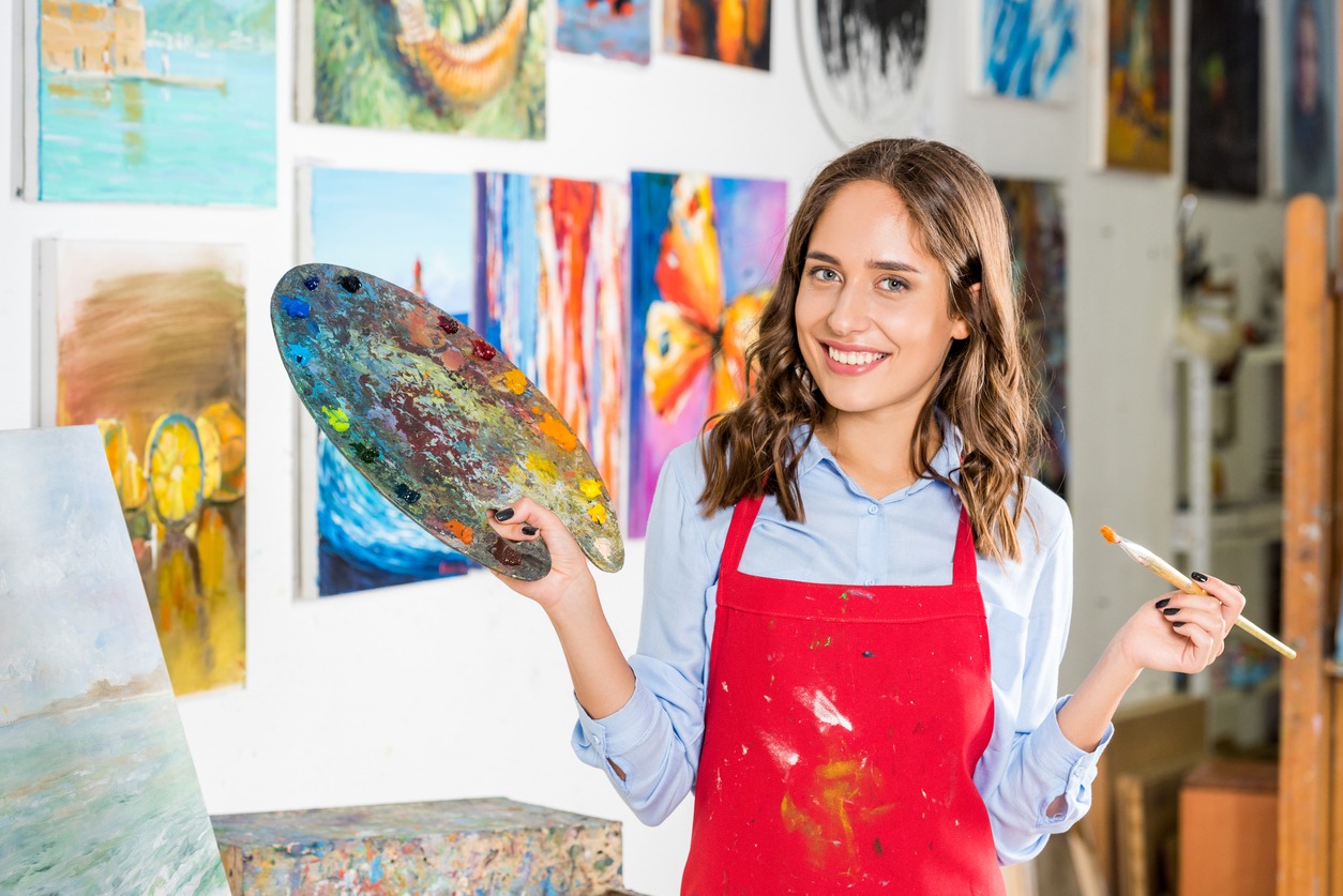 Adult, Art, Artist, Beautiful Woman, Beauty, Creativity, Indoors, Lifestyles, Occupation, Passion, Practicing, Paintbrush, Selective Focus, Painter-Artist, Professional Occupation, Young Women, Skill, Smiling, Workshop, Studio-Workplace
