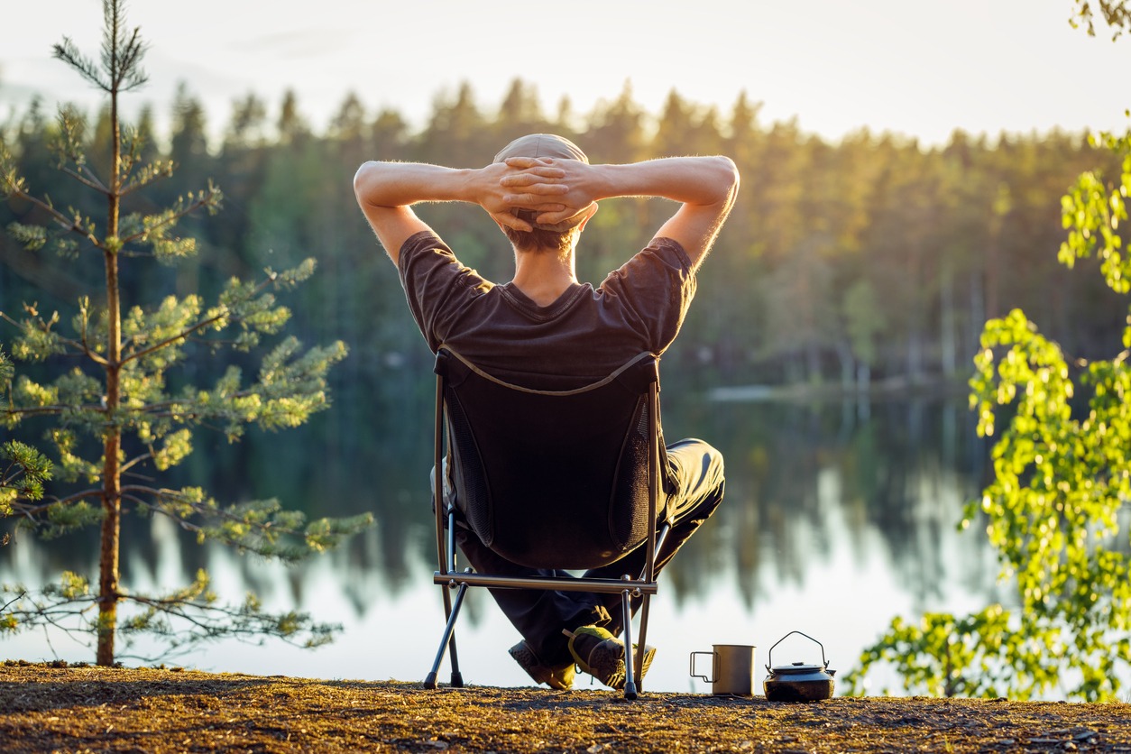 Relaxation, Nature, Hiking, People, Resting, Happiness, Tranquility, Contented Emotion, Lifestyles, Forest, Sitting, Contemplation, Environment, Outdoors, Lake, Beauty In Nature, Sunset, Outdoor Chair, Relaxation Exercise, Selective Focus, One Person