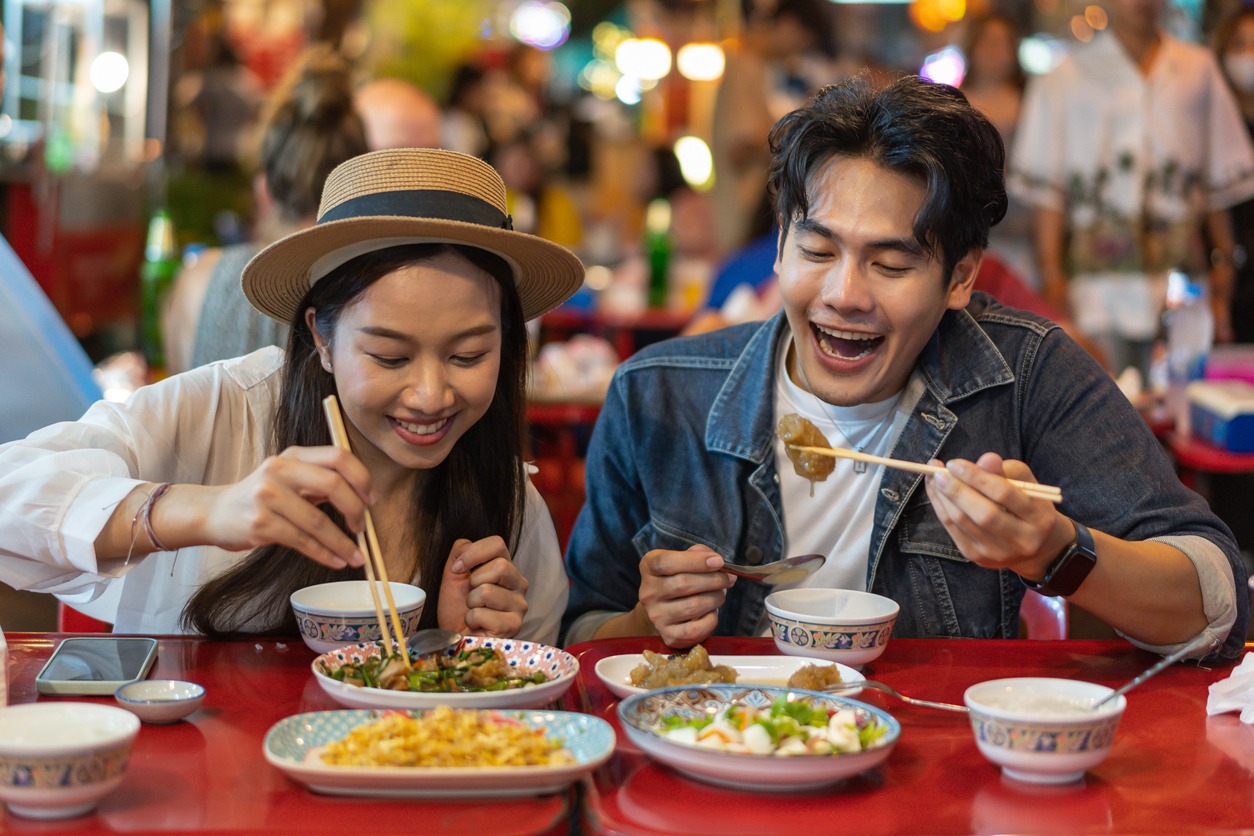 Smiling, Food, Couple – Relationship, Fun, Happiness, Healthy Eating, Enjoyment, Meal, Lifestyle, Night Market, People, Street, Street Food, Table, Togetherness, Ready-To-Eat, Adult, Friendship, Vacation