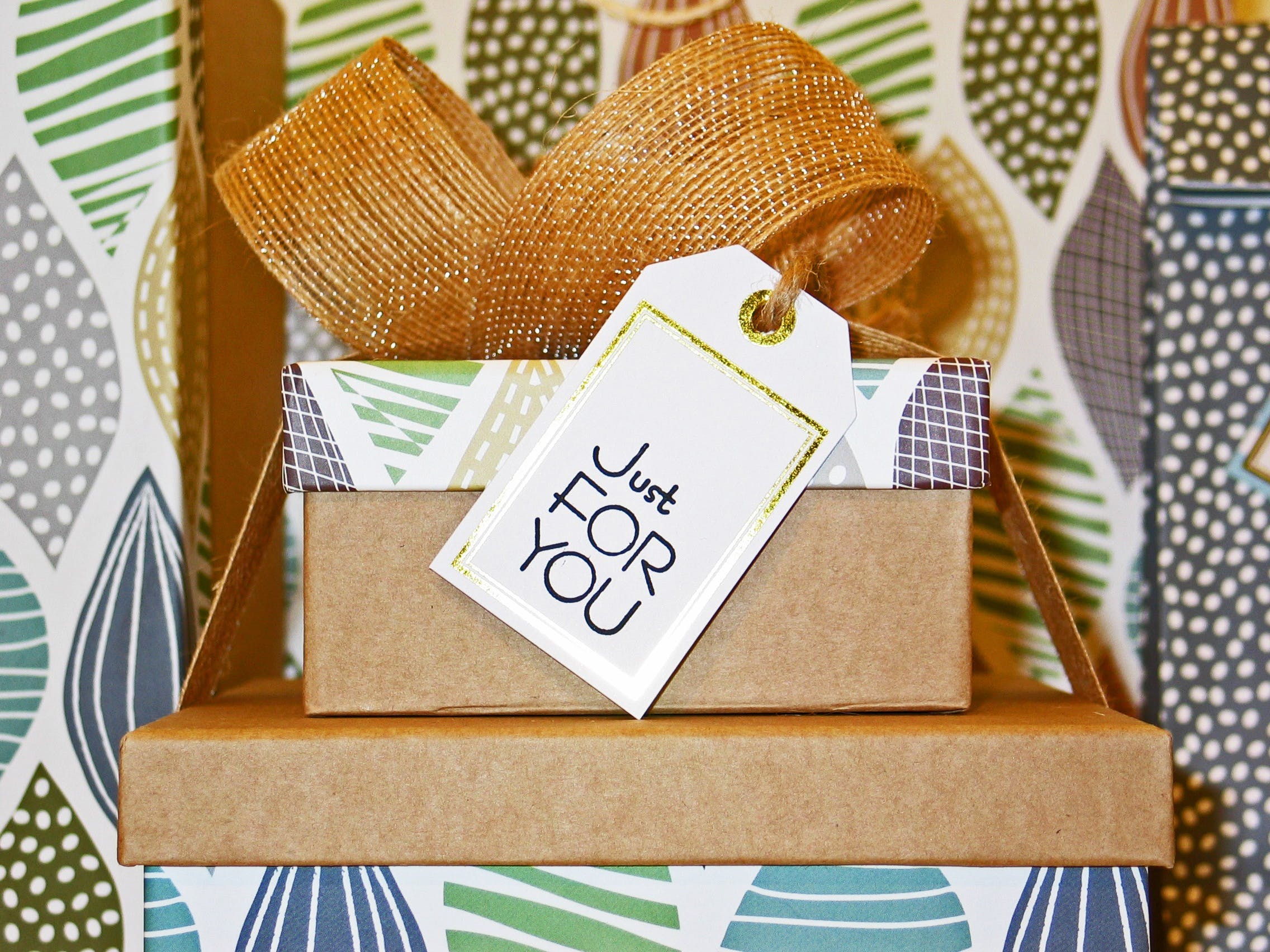 close-up photo of gift boxes with greeting card