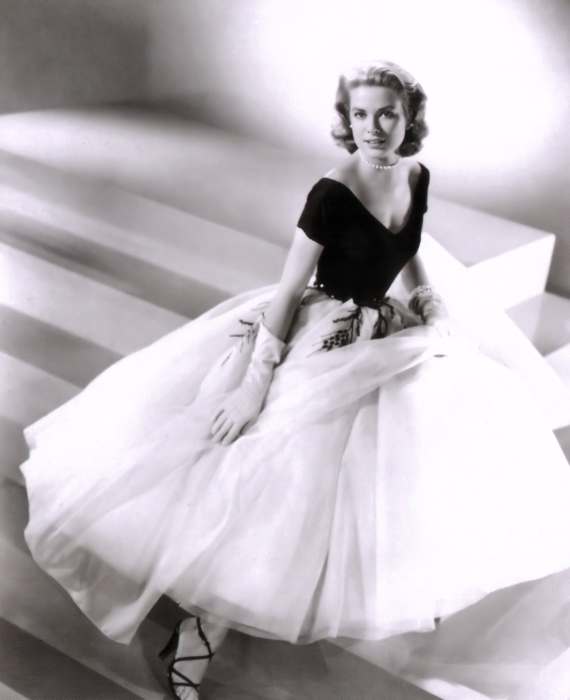 Grace Kelly wearing a dress with white skirt and gloves