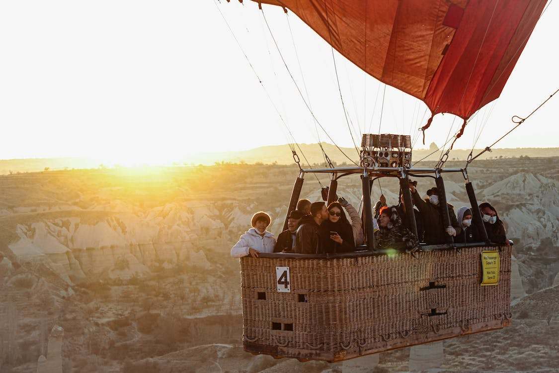 People riding a hot air balloon