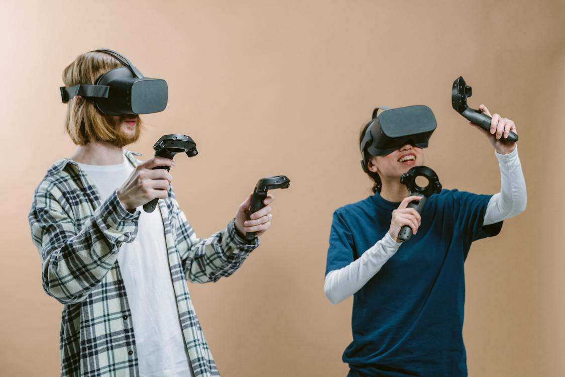 Teens playing with virtual reality gaming setup