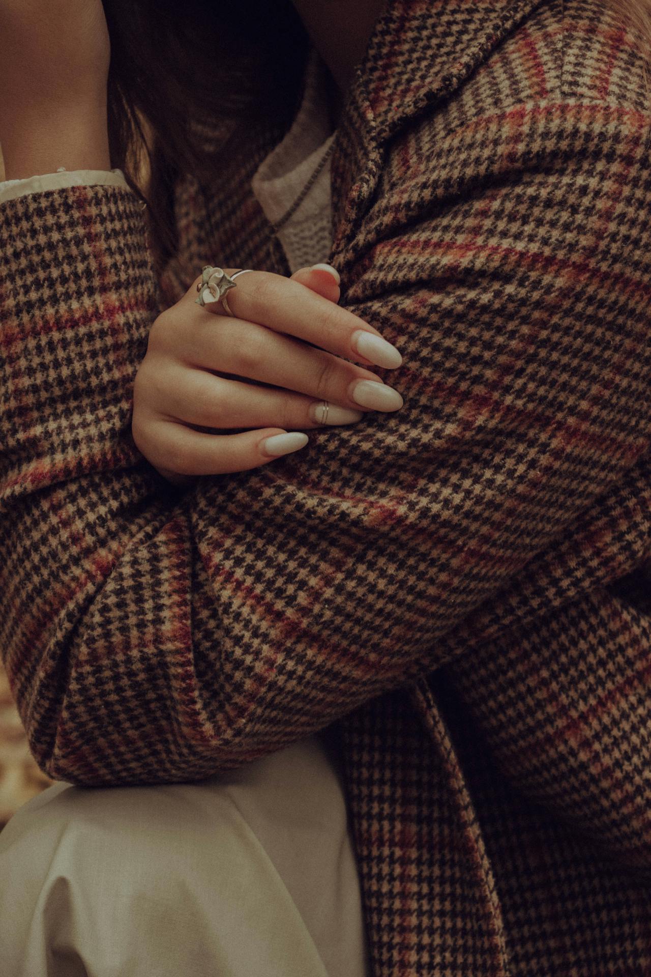 manicured-nails-on-a-checkered-blazer
